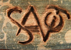 A monogram that appears to say “SATO” .