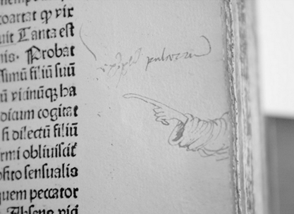 A long pencil finger points from the margins to a specific line